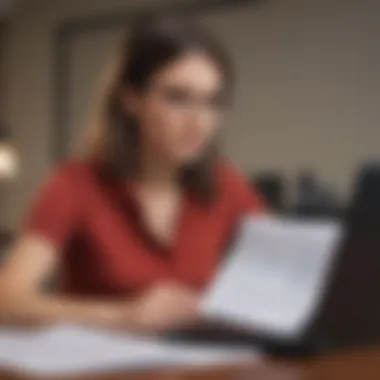 A student reviewing tax documents with a laptop